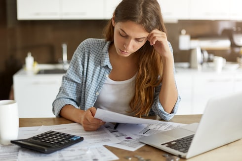 young mother worrying about bills adding up